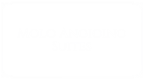 Elegant suite at Molo Angioino Suites hotel in Naples, Italy with modern amenities and comfortable accommodation
