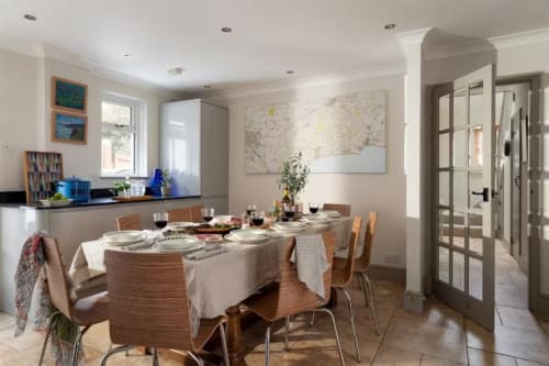 Bright dining room at 2 Doves Holiday Property, Exeter with set table and modern kitchen area