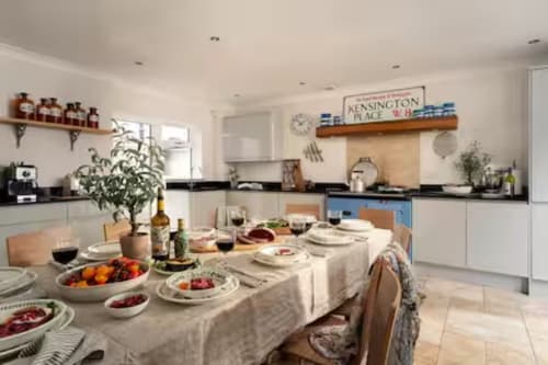 Spacious kitchen-diner at 2 Doves Holiday Property, Exeter, with dining table set for guests