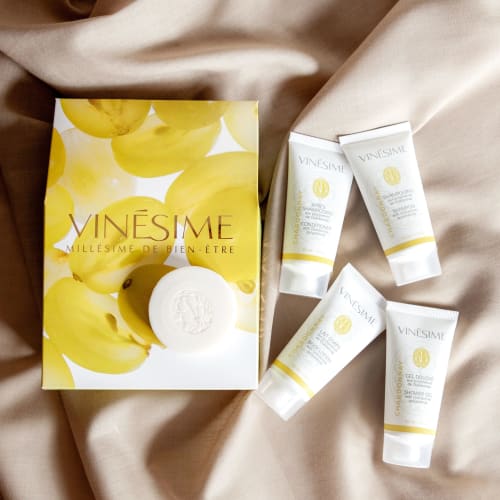 Vinesime luxury spa amenities set displayed on cream fabric at Pavillon Des Millesimes, Lussac