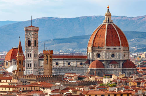 Florence Cathedral dome and bell tower with Tuscan hills, view from Michelangelo Central Suites in Firenze