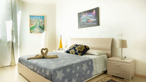 Luxury bedroom at Versilia Panoramic Hotel in Como, Italy, featuring beachfront-view apartment with coastal décor and modern