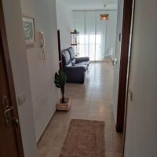 Bright hallway entrance at Love Rent4 Malaga apartment in Torremolinos with living room visible ahead