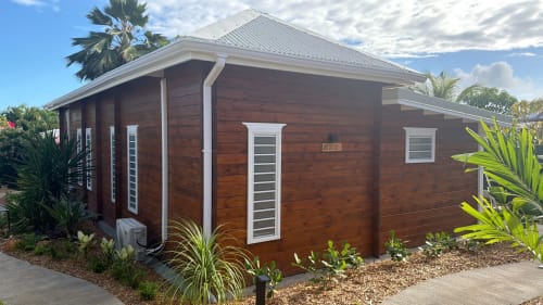 Filao Cottage Anse Caraïbe, wooden bungalow with white trim and metal roof in Sainte-Rose, Guadeloupe