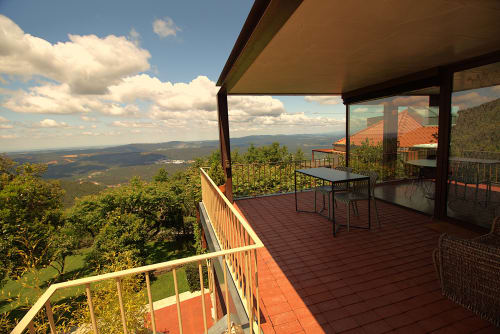 Terrace with mountain views at Pera da Serra rural accommodation in Lousã, Portugal, featuring outdoor dining area and