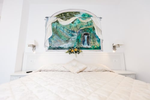 Bright bedroom at L'Amaranto B&B in Agerola with white bedding and scenic mountain landscape wall mural above headboard