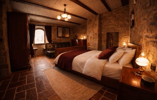 Stone room with a medieval window and a warm atmosphere
