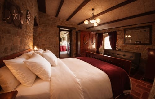 Historic room with stone walls and warm tones in a medieval fortress