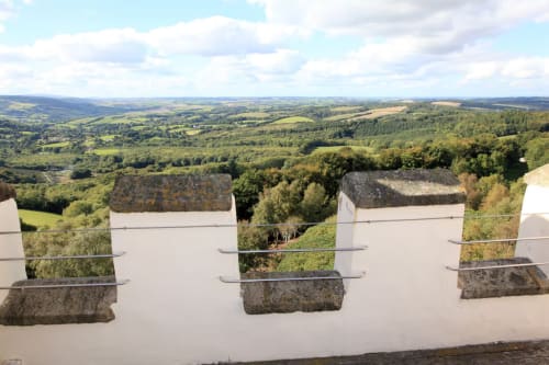 Panoramic valley view from 2 Doves Holiday Property terrace near Exeter, rolling hills and green landscape