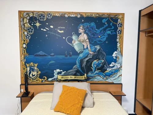 Golden Mermaid Villa bedroom in Ribeirinha with mermaid-themed headboard mural, wooden bed frame, and yellow pillow.