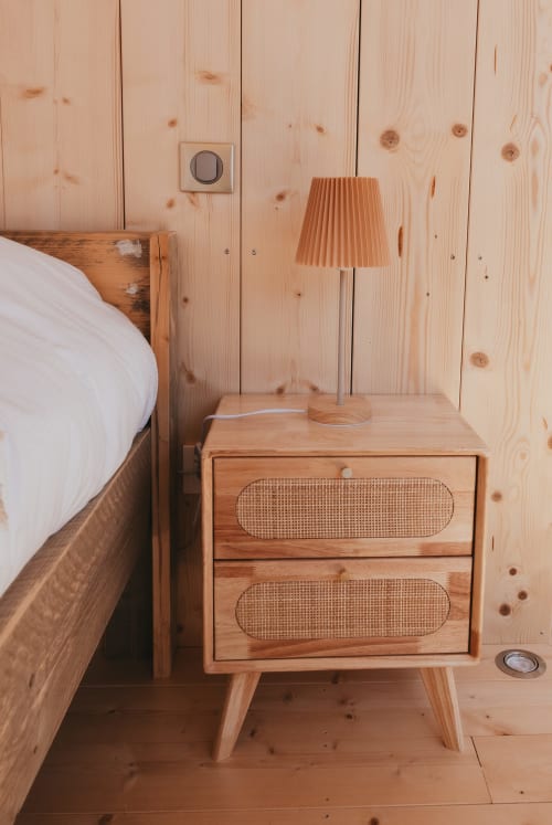 Wooden nightstand with pleated lamp in geodesic dome cottage at Les Cabanes du Nideck, Oberhaslach