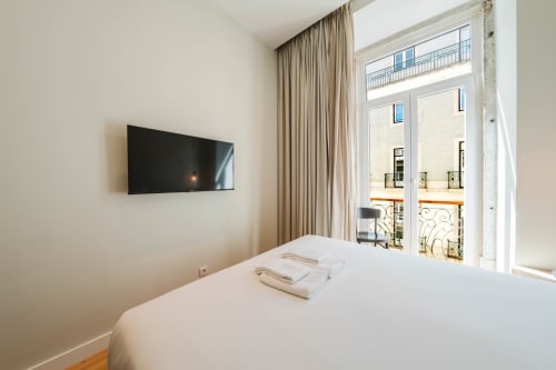 Premium Suite at GS Chiado Boutique Studios with city view, flat-screen TV, and Parisian-style balcony in Lisbon