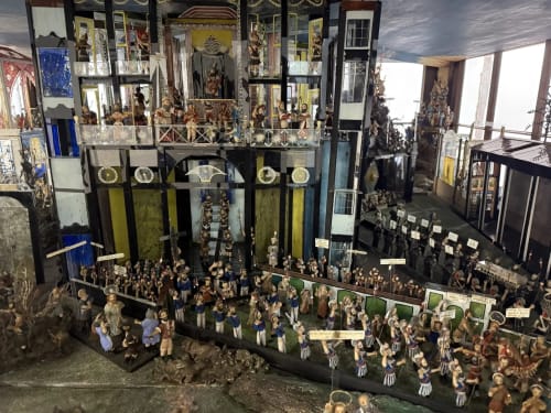 Intricate miniature diorama display at Golden Mermaid Villa, Ribeirinha Portugal - showcasing detailed figurines and