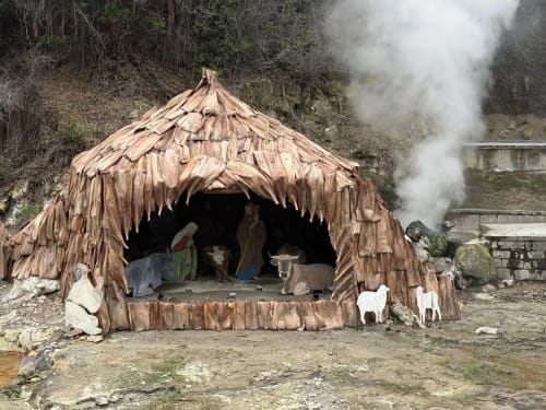 Traditional thatched-roof hut with white goats at Golden Mermaid Villa, Ribeirinha Portugal geothermal area