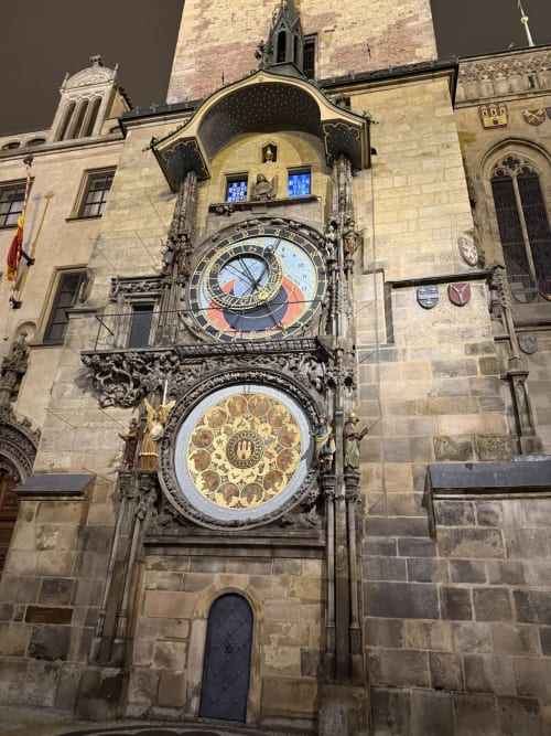 Historic astronomical clock tower in Ribeirinha, Portugal at night