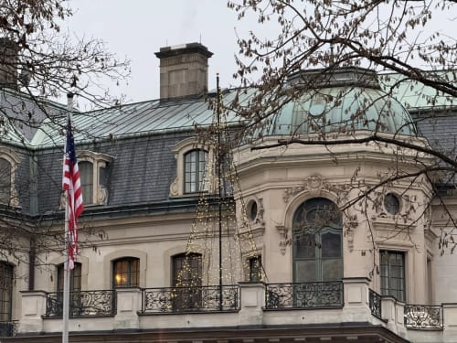 Golden Mermaid Villa exterior in Ribeirinha with French architecture, mansard roof, and decorative holiday garland