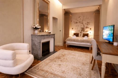 Luxurious Suite Lucas de Montigny at Les Suites de Montigny in Aix-en-Provence with bedroom, fireplace, and seating area