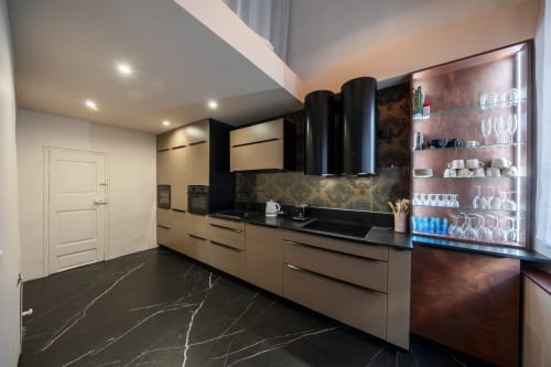 Modern kitchen in Suite Lucas de Montigny at Les Suites de Montigny, Aix-en-Provence, with black marble flooring, beige