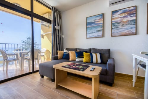 Modern living room with sea view balcony at Sunset Bay 509, Las Palmas Gran Canaria apartment