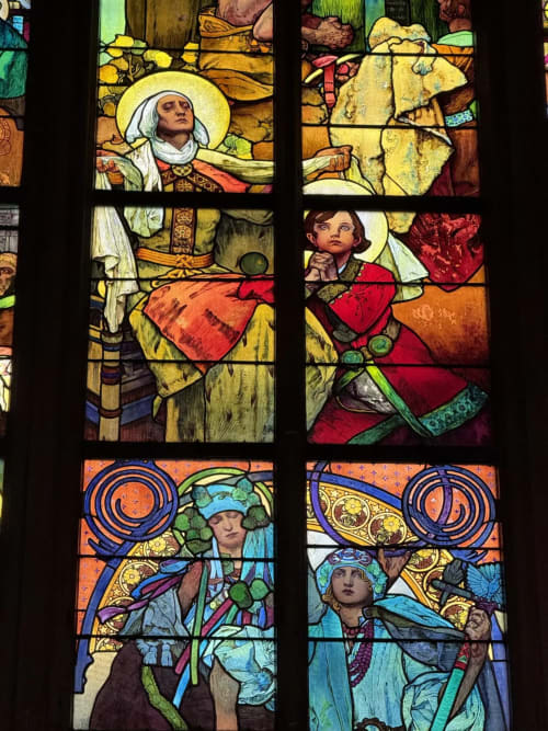 Colorful stained glass windows depicting figures in medieval clothing at Golden Mermaid Villa, Ribeirinha Portugal