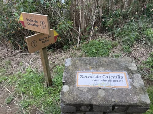 Trail signs at Golden Mermaid Villa in Ribeirinha, Portugal marking hiking paths to Rocha do Cascalho and Rocha da Relva