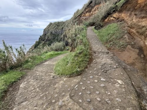 Coastal hiking trail at Golden Mermaid Villa, Ribeirinha, with ocean views and seaside vegetation