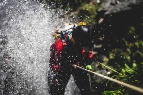Adventure seeker canyoning at waterfall near Check Madeira in Ribeira Brava