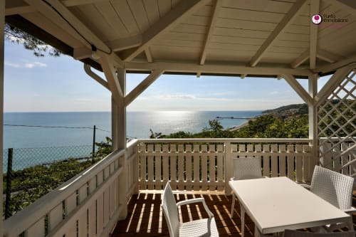 Villa Nella sea view terrace in Lanciano with dining area, coastal vista, and furnished outdoor space