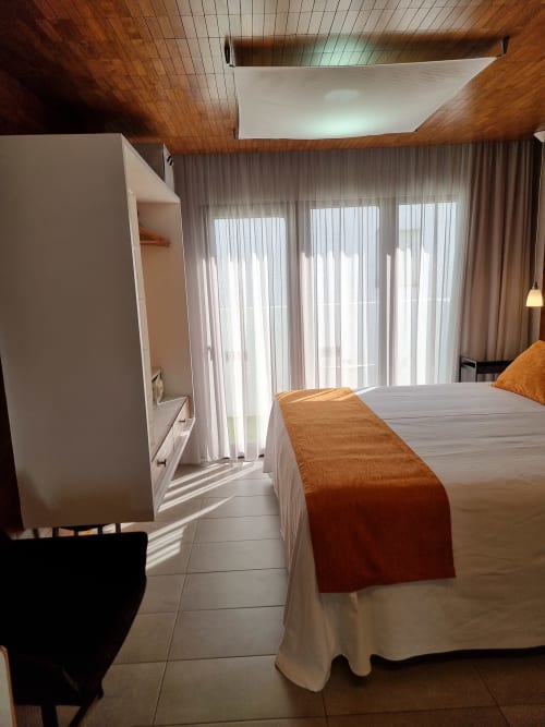Modern bedroom at El Arrecife de Conil in Conil de la Frontera with double bed, terrace view, and contemporary amenities