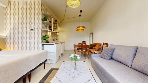 tARTu Stays apartment in Tartu featuring modern studio with sofa, bed, dining area, and city view