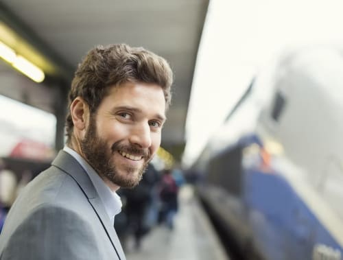 Smiling man in business attire at Palazzo Vittoria, Padova boutique hotel