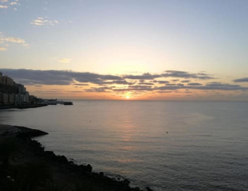 Sunset over the Atlantic Ocean from Tabaiba Ocean View apartment in Santa Cruz de Tenerife, Spain