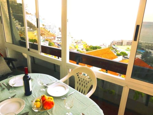 Dining table with sea views from Tabaiba Ocean View apartment in Santa Cruz de Tenerife, Canary Islands