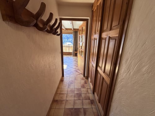 Hallway in Appartement Le Vores at Chez Francine with wooden doors, terracotta tiles, and mountain views in Notre Dame de