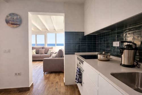 Modern kitchen with sea view overlooking living room in Apartamento Severo 3, La Aldea vacation rental
