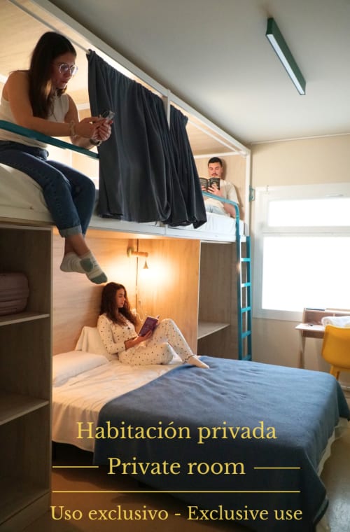 Private room at Lemon Hostel Altea with bunk beds, guests relaxing, modern hostel accommodation in Spain