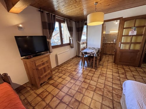 Studio Aravis apartment at Chez Francine in Notre Dame de Bellecombe with wooden ceiling, TV, dining area, and city view