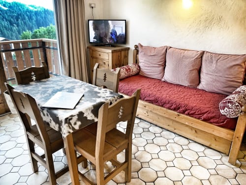 Studio Lachat at Chez Francine with alpine views, wooden furniture, mountain-view balcony, and cozy bedding in Notre Dame de