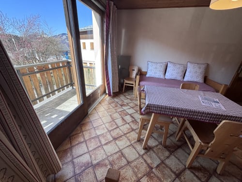 Studio apartment at Chez Francine with bed, terracotta tiles, balcony overlooking mountains in Notre Dame de Bellecombe
