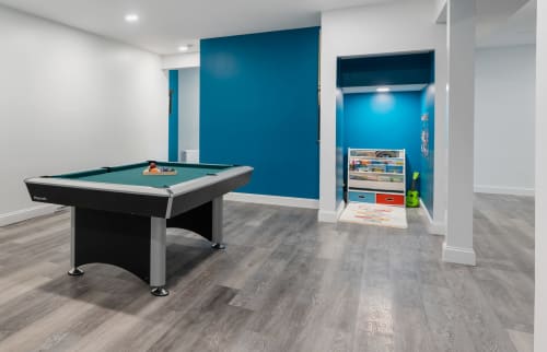 Modern recreation room at Malkita Aria villa in Highland Mills with pool table and children's play area