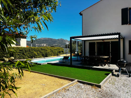 Modern villa in Zilia with private pool, garden lounge area, pergola, and mountain views