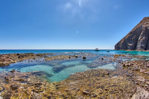 Rocky cove with crystal clear turquoise waters near Hostal San Andres in Carboneras, Spain