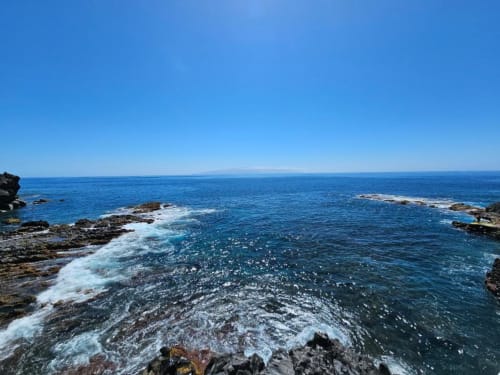 Scenic ocean view from Olivia Playa La Arena apartment in Tenerife with rocky coastline and waves