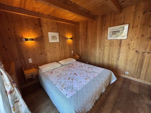Cozy wooden bedroom with double bed at Chez Francine, Notre Dame de Bellecombe, mountain view apartment