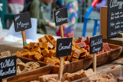 Artisan fudge display with flavors like Mango, Raspberry, Coconut, and Chocolate Orange at Stonegate Townhouse, York