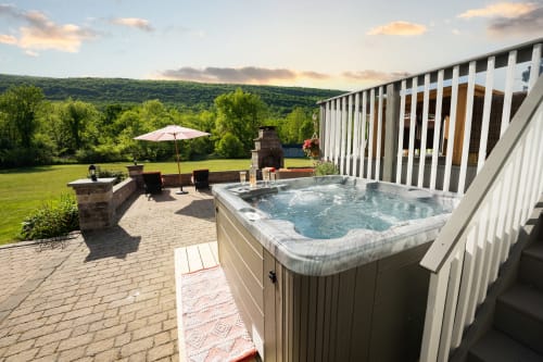 Malkita Aria villa hot tub overlooking mountains at Highland Mills retreat with patio and lawn views