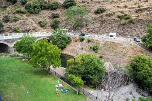 River view from Hotel Mulhacén Trevélez terrace overlooking Río Trevélez with mountain landscape and parking area