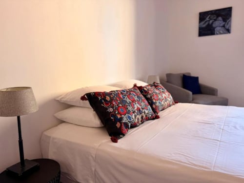 Modern Premium Double Room at Casa Sibarita with white bed, decorative pillows, bedside lamp, and city view in Rafelguaraf