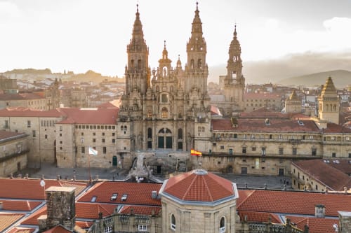 Cathedral of Santiago de Compostela overlooking Padrón, Spain with terracotta roofs and historic architecture