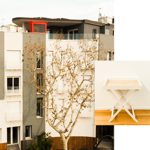 Facciata del Modern Hotel Vienna a Pesaro con architettura minimalista bianca, porta rossa e albero secco